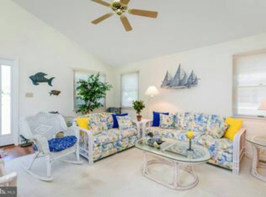 Living room with tv/DVD player, games and toys. Stocked with adult and childrens games and dvds.