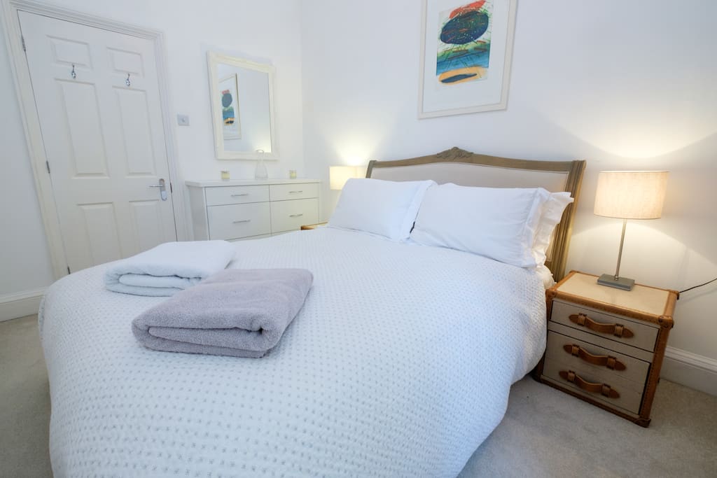 Bedroom 1 with a comfortable king size bed with fresh white linen