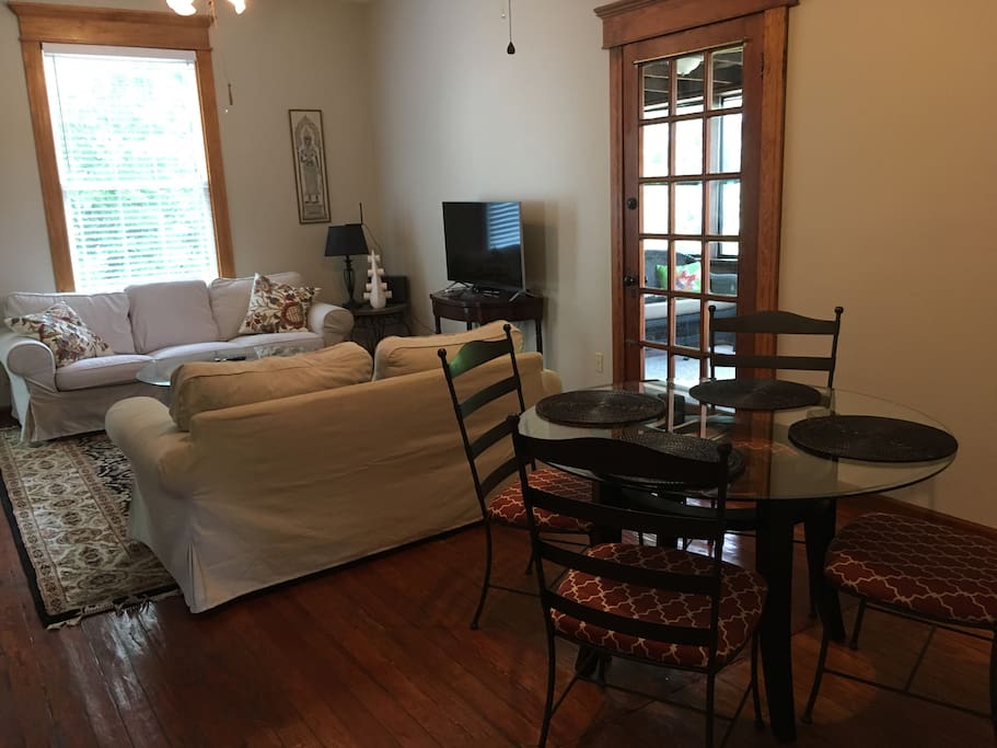Large living room with dining seating for four