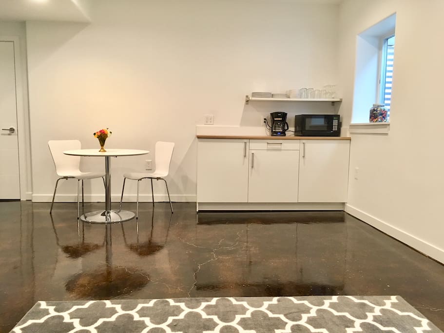 There is a kitchenette with mini-fridge, microwave, coffee maker and basic tableware for your use,