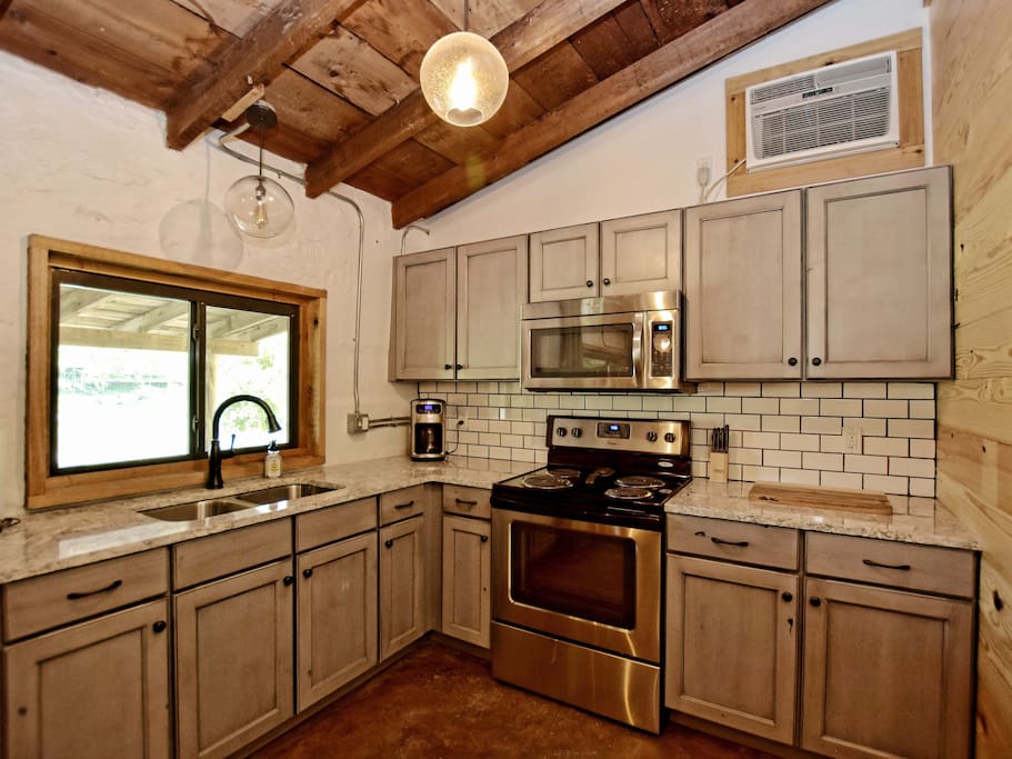 Full kitchen with a refrigerator