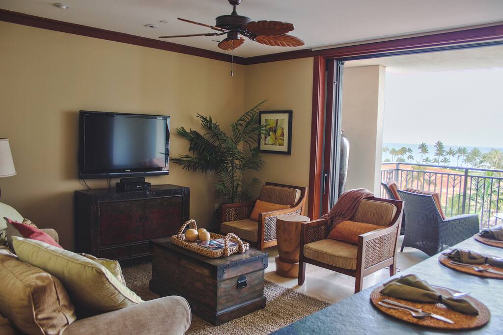 Take a break from the sun and cozy up on the couch with your favorite book.