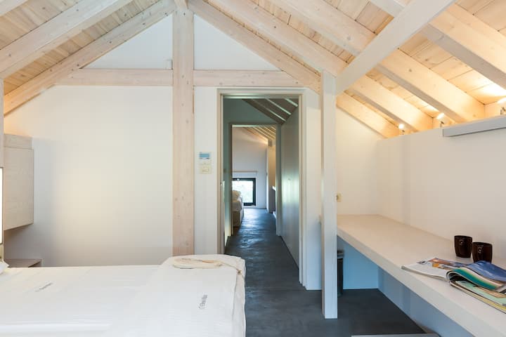Bedroom with 2 single beds on our Loft