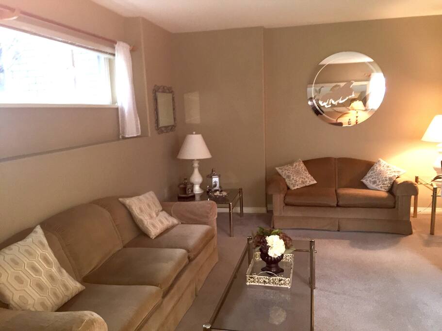 Living room area has desk/work station, wifi, smart TV and comfy seating.