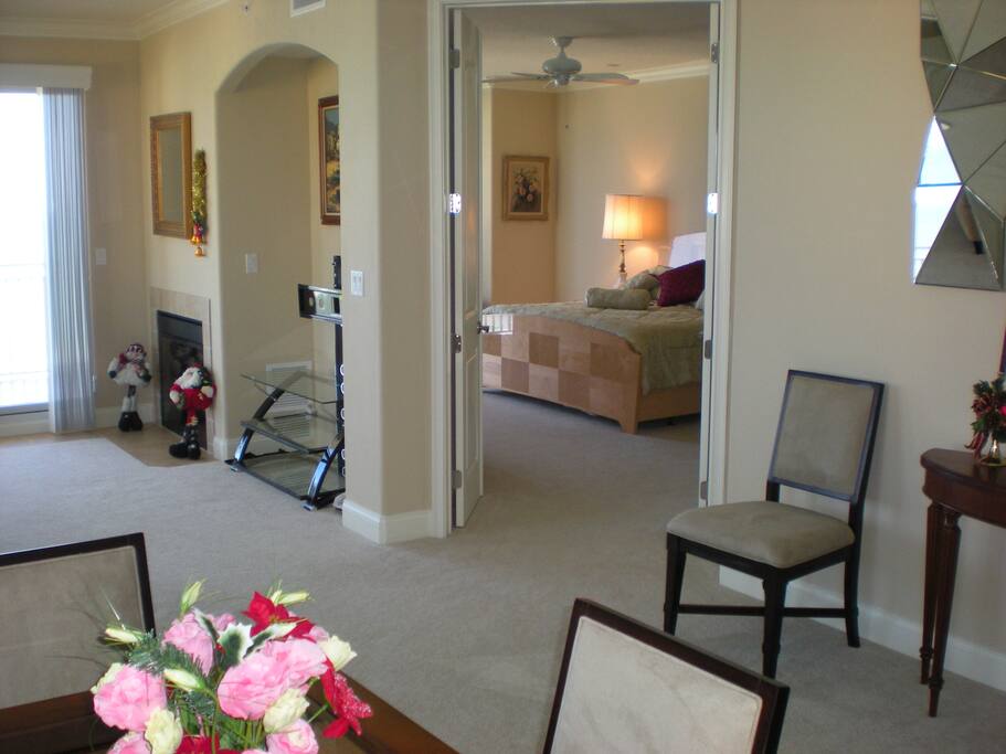 View into Large Master Bedroom w/King Bed from Dining Room