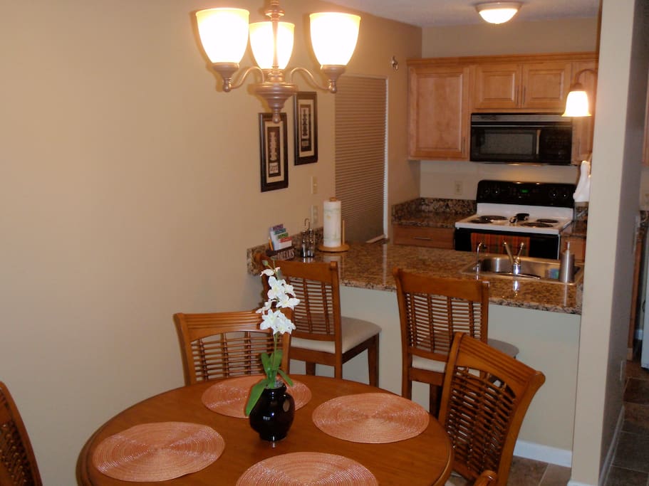 Full kitchen and dining room for four.