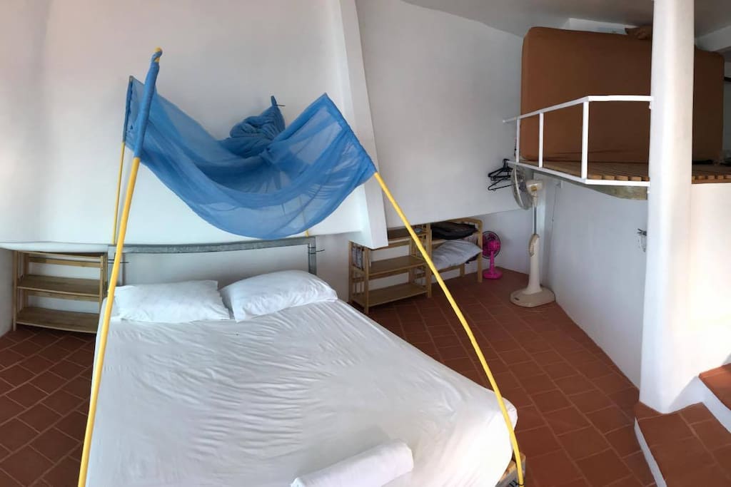 Double bed with removable mosquito net