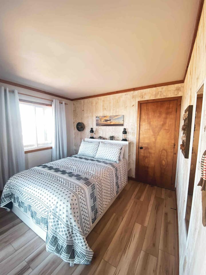 Double bed frame has four large drawers for storage.