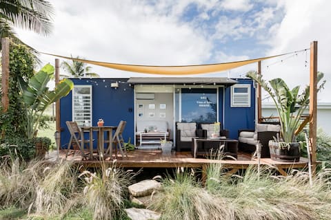 Experience Tropical Camping at a Cabin Close to the Ocean