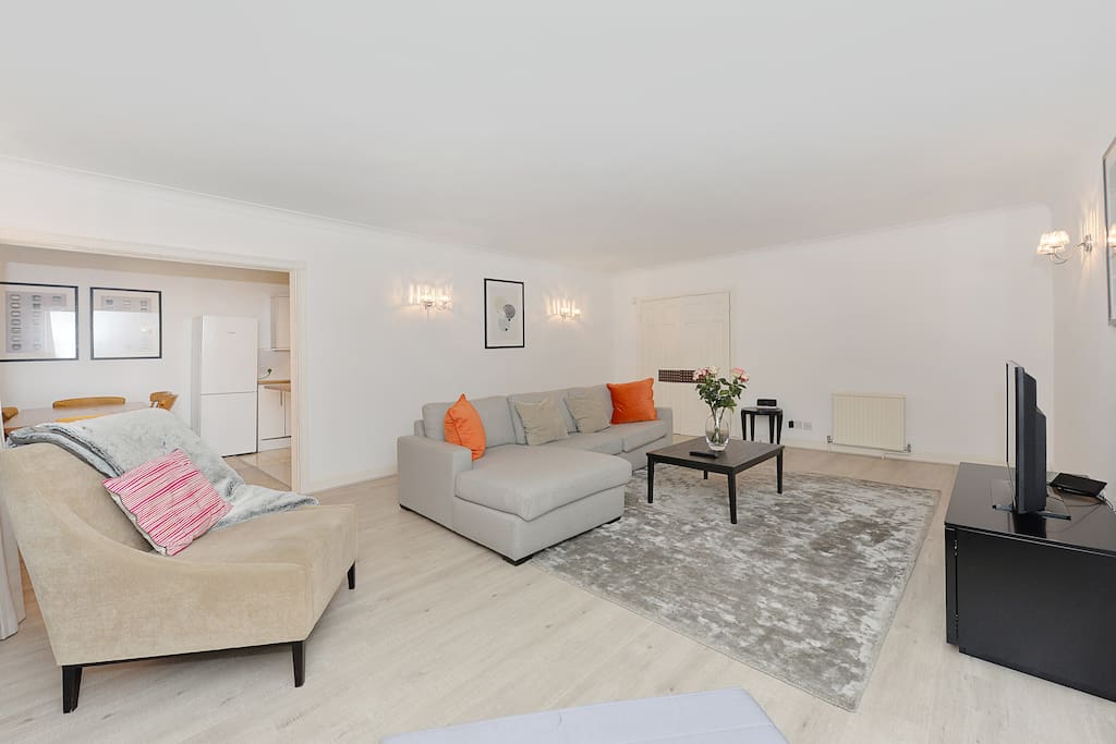 The spacious Lounge with L shaped sofa, armchair, flat screen TV, Freeview channels, Free WiFi and more