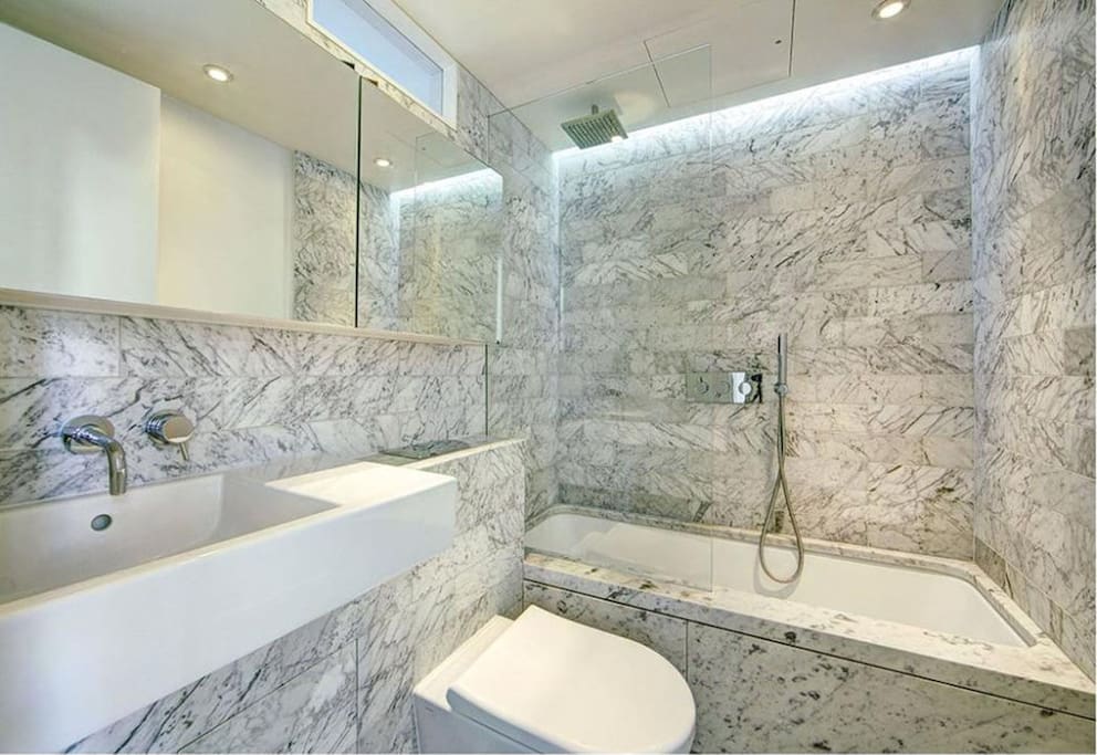 Bathroom with shower over tub
