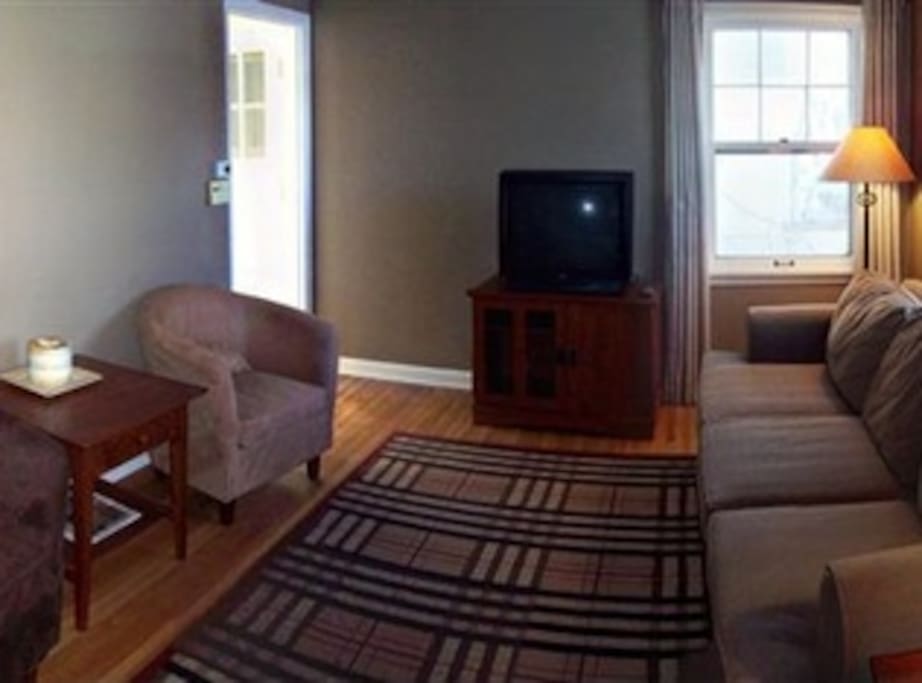 Couches, apple TV, large flatscreen (not pictured), wifi