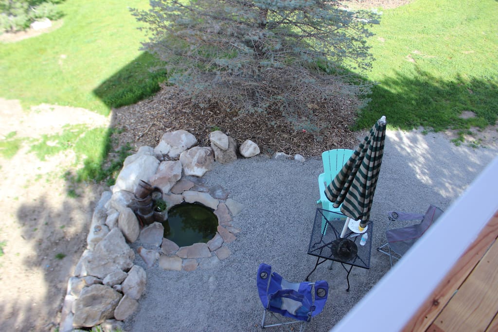view from deck of water feature and picnic area