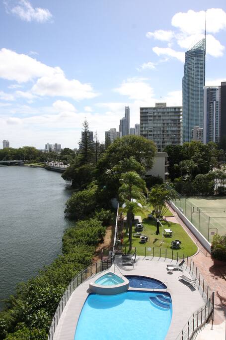 From the Balcony River, Pool, Spa, BBQ Area & Tennis Court.