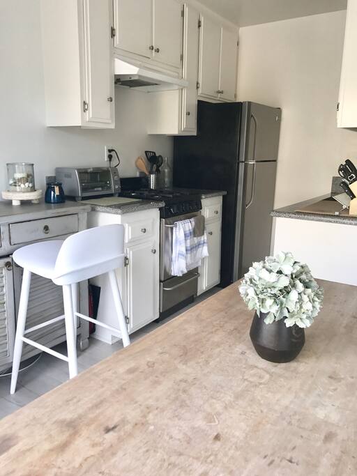 Refrigerator, stove with oven, kitchen sink, and toaster oven available.