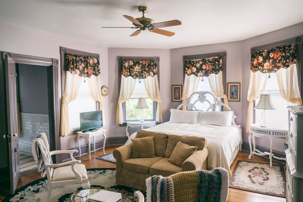 Easton Room - King Bed Surrounded by Antique Bay Windows, Sleeper/Sofa and Seating Area, Entrance to Bathroom