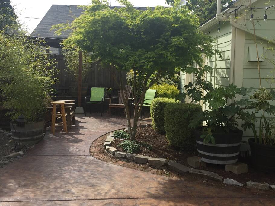 Outdoor sitting area in backyard shared with hosts.