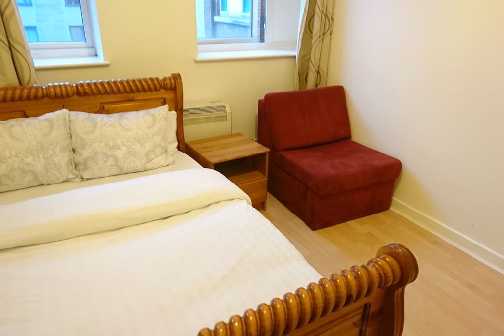 Main Bedroom Includes a Queen Bed with a Single sofa. Sofa converts into a bed