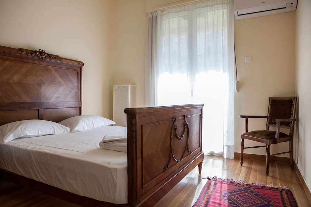 A queen bed welcomes you in the master bedroom