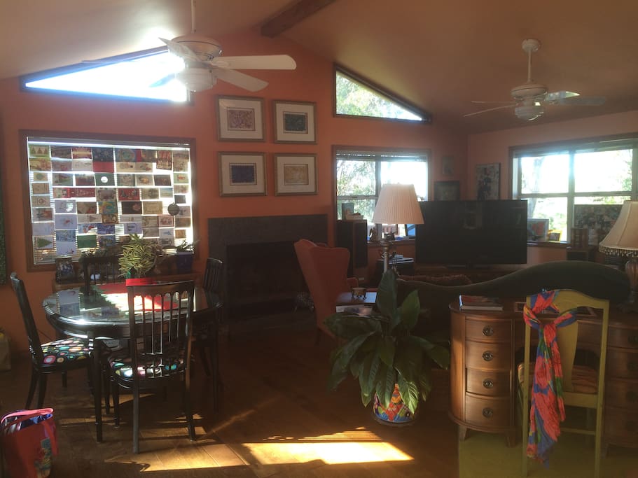A spacious & comfortable Family Room to relax in. There is a fireplace & a gynormous TV.