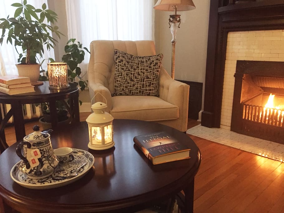 Living room with a lovely space for reading by the fireplace
