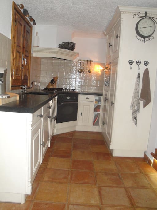 Kitchen with dishwasher oven and magnetron