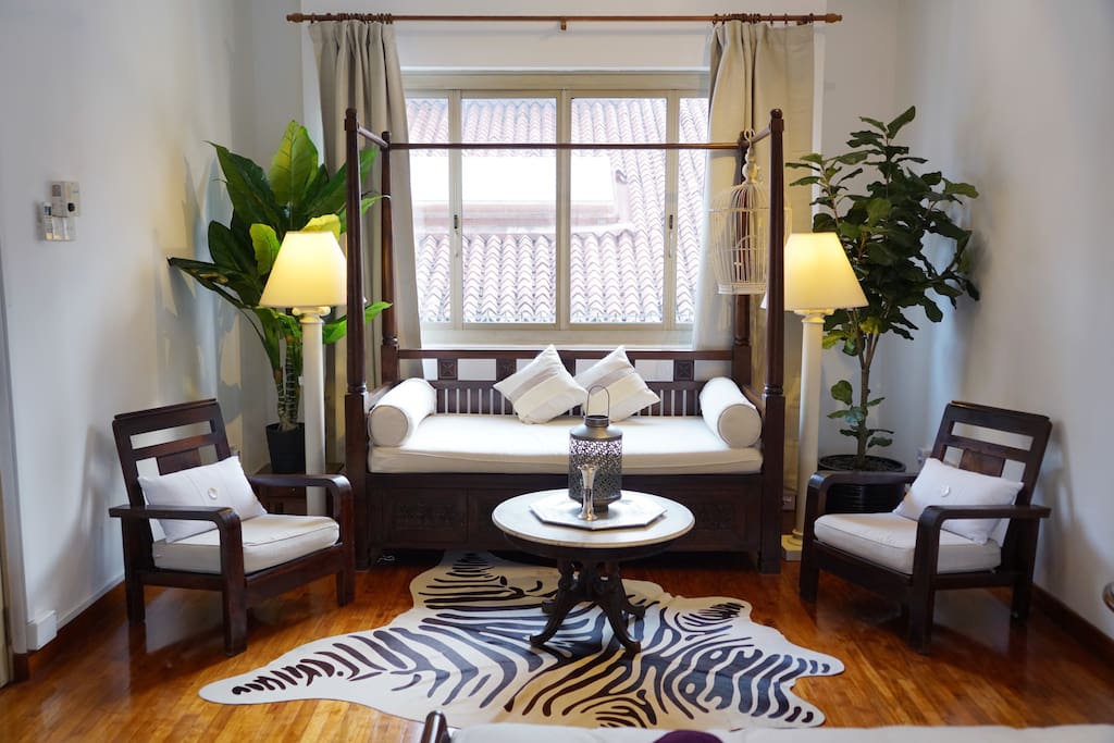 Surrounded by lush plants, our lovely zebra rug adds a touch of exotic fancy to this solid, antique teak wood 4-poster daybed that also sleeps one! Perfect for quiet afternoons reading/lazing by the window. :) We are also able to provide bed linens and pillows for your extra guest should you inform us at the time of your booking ;)