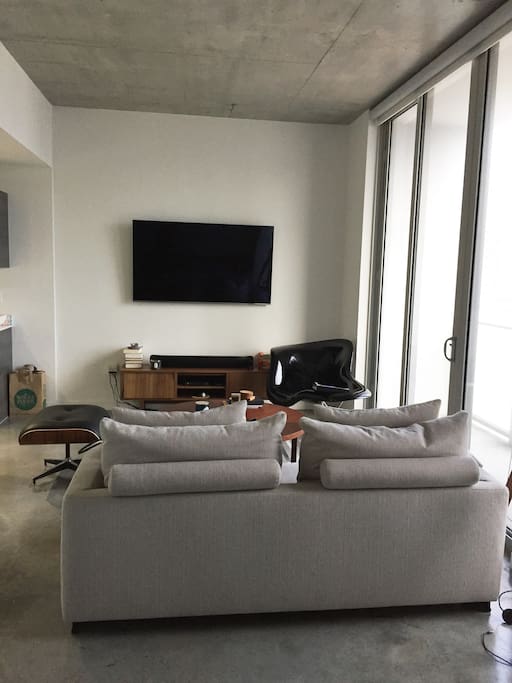 Spacious living area with a Samsung 65" LED HD TV + Apple TV !!!