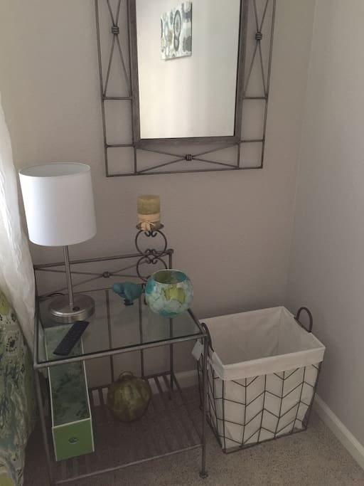 Nightstand with extra lighting, room also has desk and chair ( not shown)
