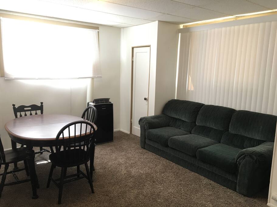 Living area with the closet in the corner.