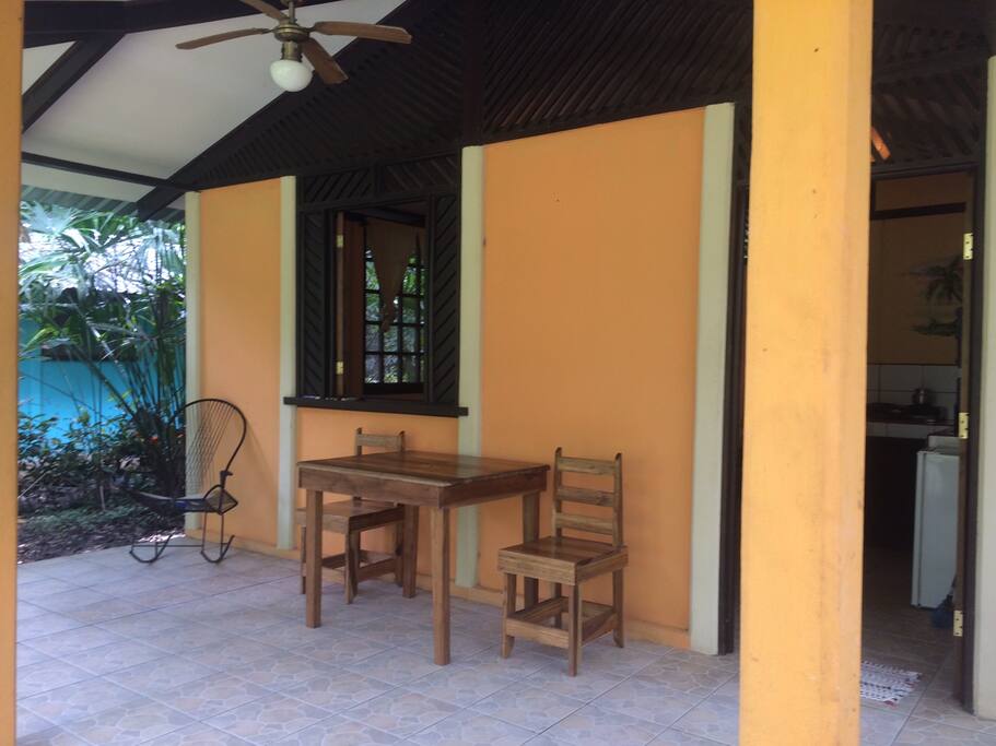 Front porch with table & chairs, rocking chair and hammock