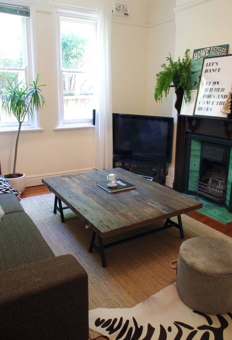 Flat screen TV, Large Couch and Coffee Table, Foxtel, DVD player, Ornate decorative fireplace