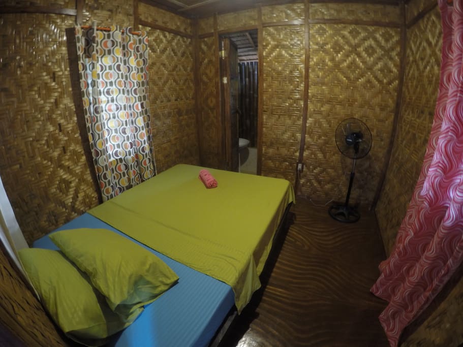 Room with mosquito net and stand van
