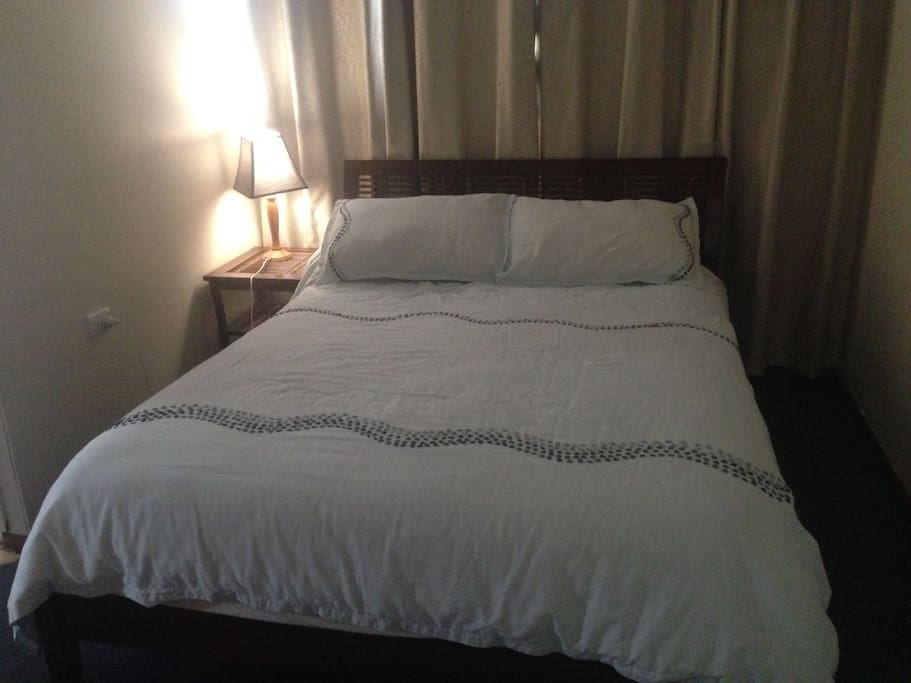 Guest room with a queen size bed plus a single bed and ensuite