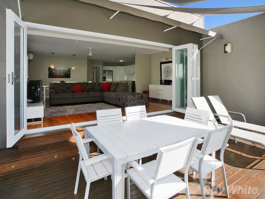 Bi fold doors open up to create an indoor outdoor space