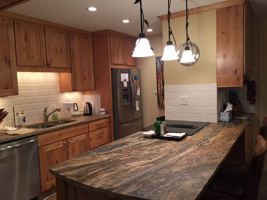 Remodeled kitchen with stainless steel appliances. Dishwasher, coffee maker, crock-pot