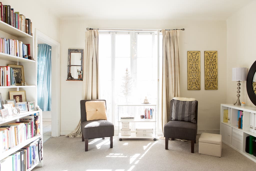 Big bright windows and sitting area.