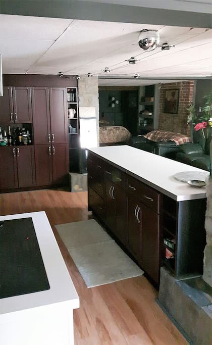Distinct kitchen, living, and sleeping areas