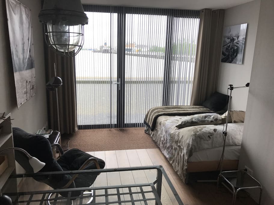 your bottom floor: bedroom, small kitchen, table/desk, toilet.