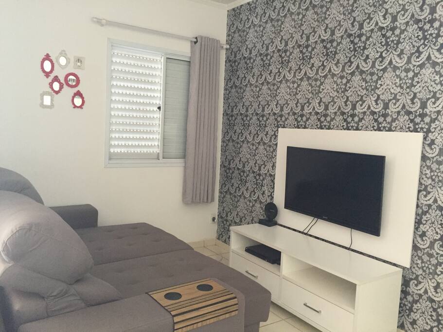 Sala de TV com sofá cama