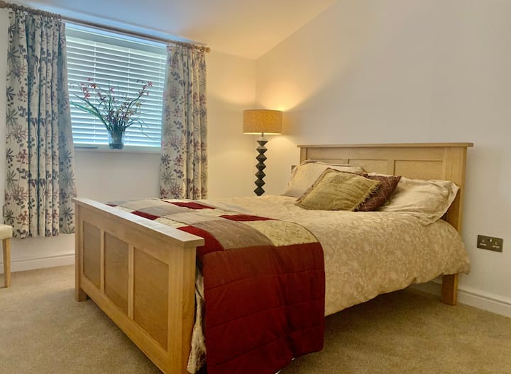 Bedroom 2. Comfortable double bed with en-suite facilities, underfloor heating and a ceiling fan.