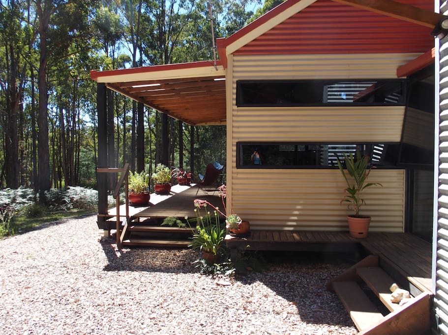 Relax on the deck with views through the forest.