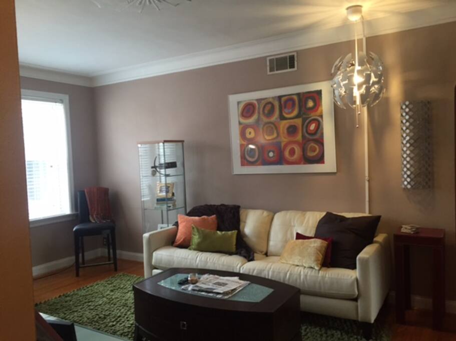 Living area with cable tv, kitchen table with four chairs, world's most comfortable napping couch : )