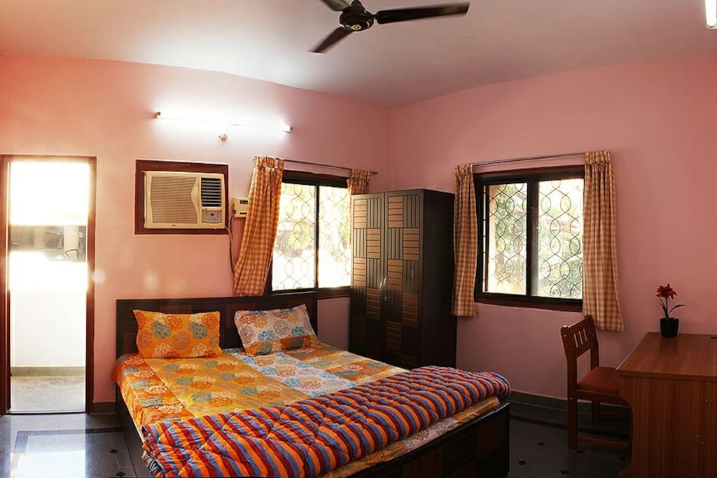 Bedroom 2 - Double -bed, Laptop working table, Wardrobe, curtains and a small balcony are the facilities.