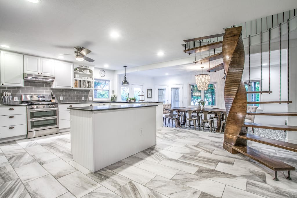 Kitchen: Open kitchen and dining area are complemented by a beautiful staircase that leads to the two upstairs bedrooms and bath.