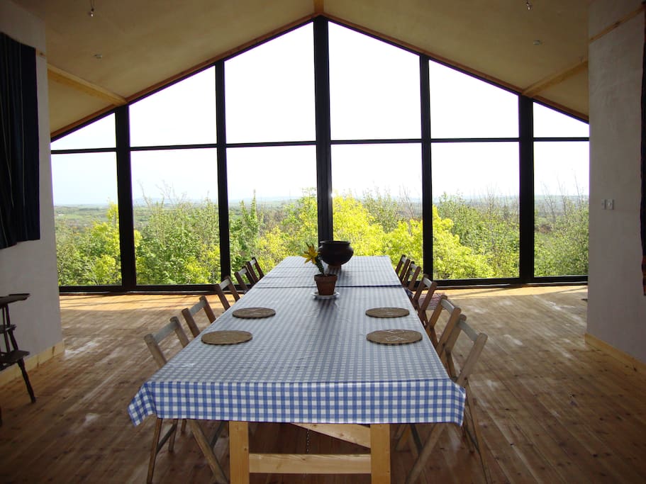 The long dinning table can seat up to 20 - great for entertaining or spreading out that tour map!