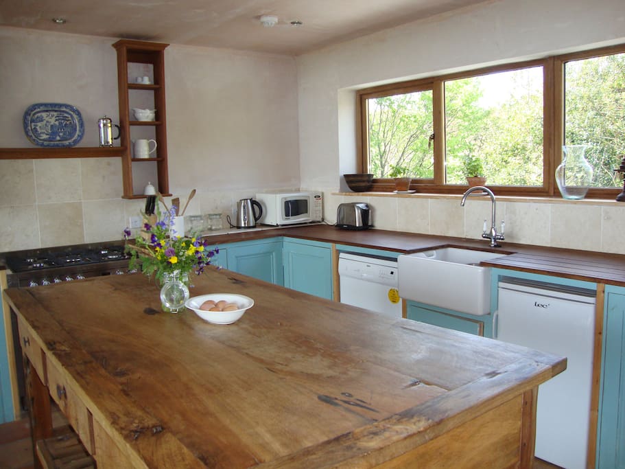 The modern open-plan kitchen is fully equipped.