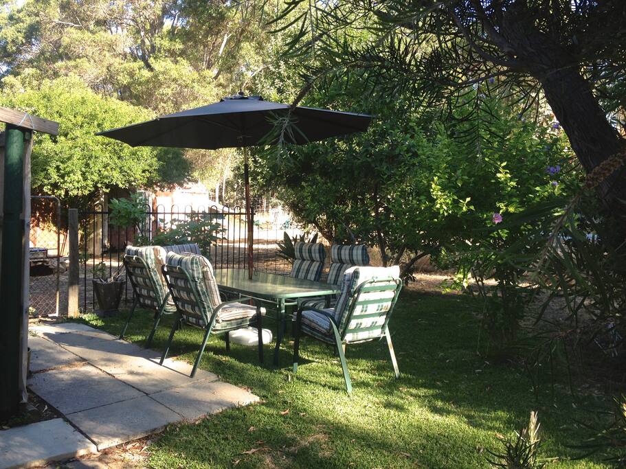 Relax in the shade on the back lawn.