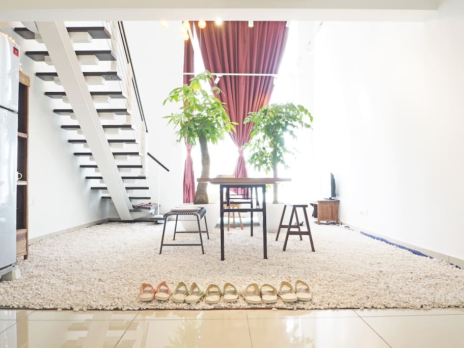 Entering the home with a landscape garden at the lower level