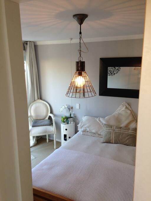 Master bedroom with french doors out to a small private deck